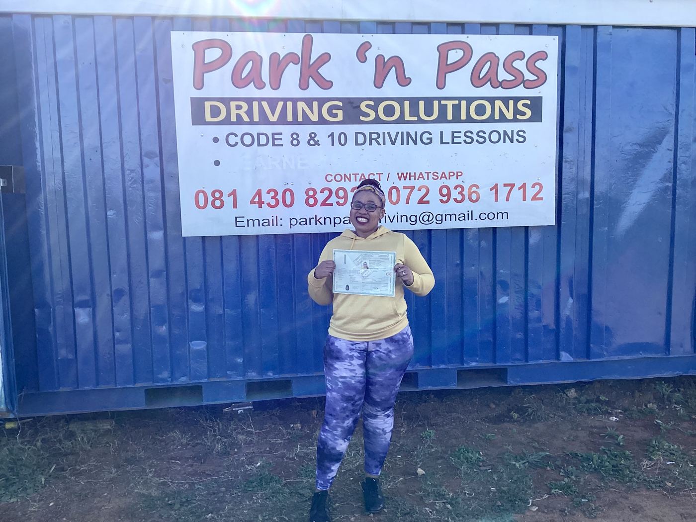 Park 'n Pass student holding their new licence